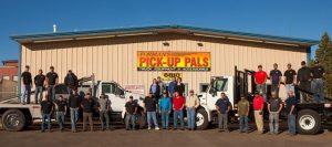 Pick-Up Pals employees in front of building