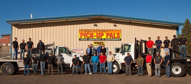 Pick-Up Pals employees in front of building