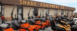 Shade Equipment Company lawnmowers in front of building